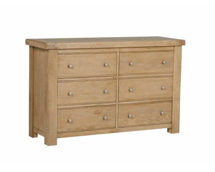 Wooden dresser with six drawers on a white background