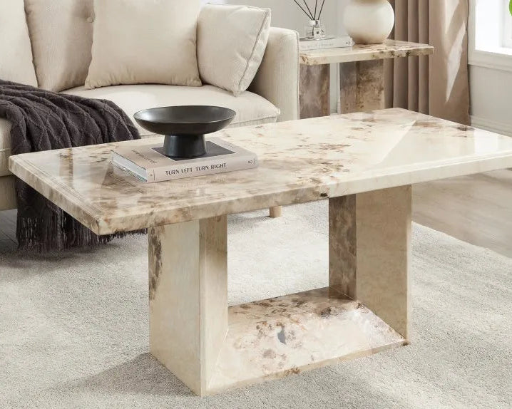 marble coffee table styled in neutral living room with sofa and modern decor