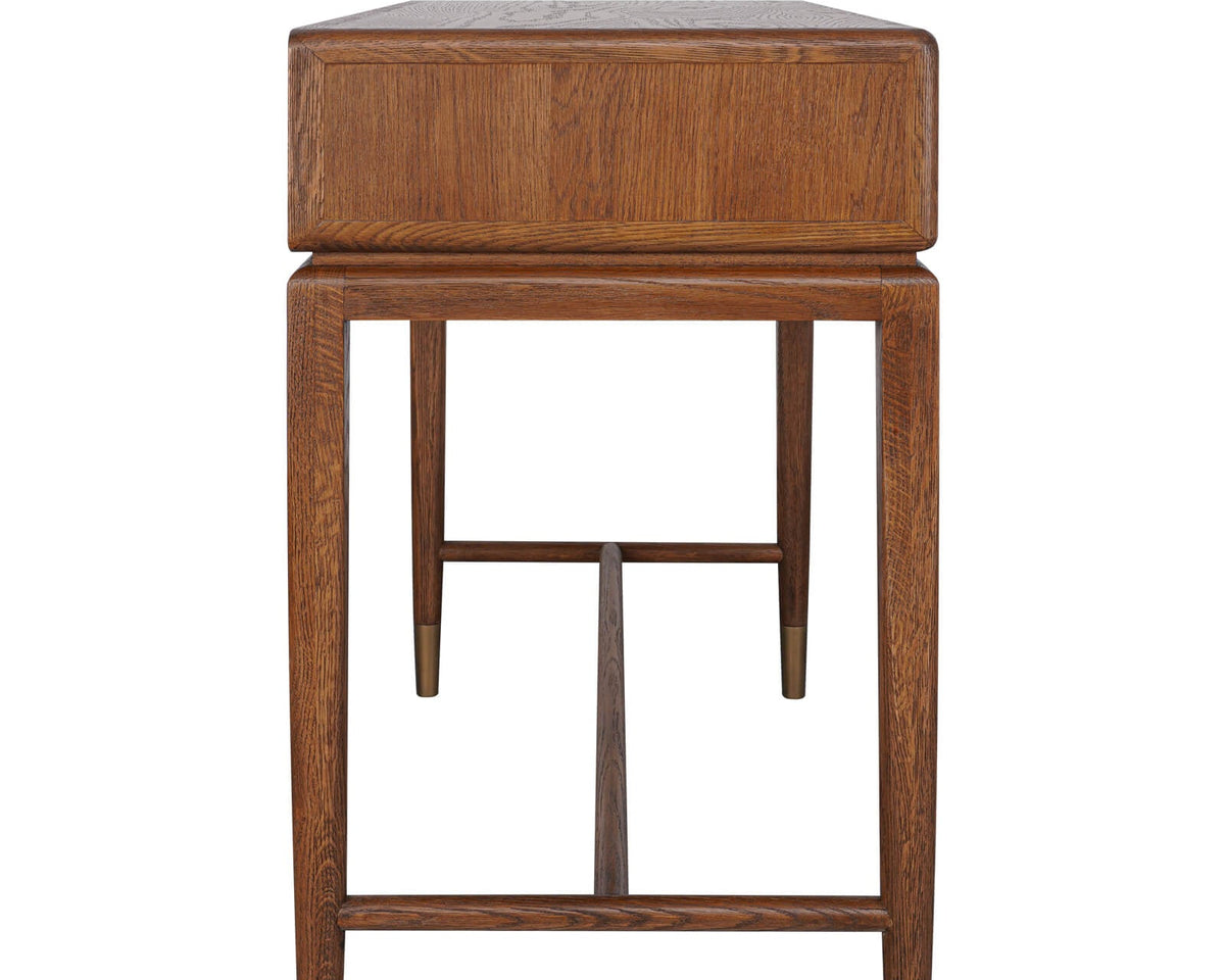 Side profile of the Birdlip console table showing the oak wood grain, slender legs and lower stretcher construction