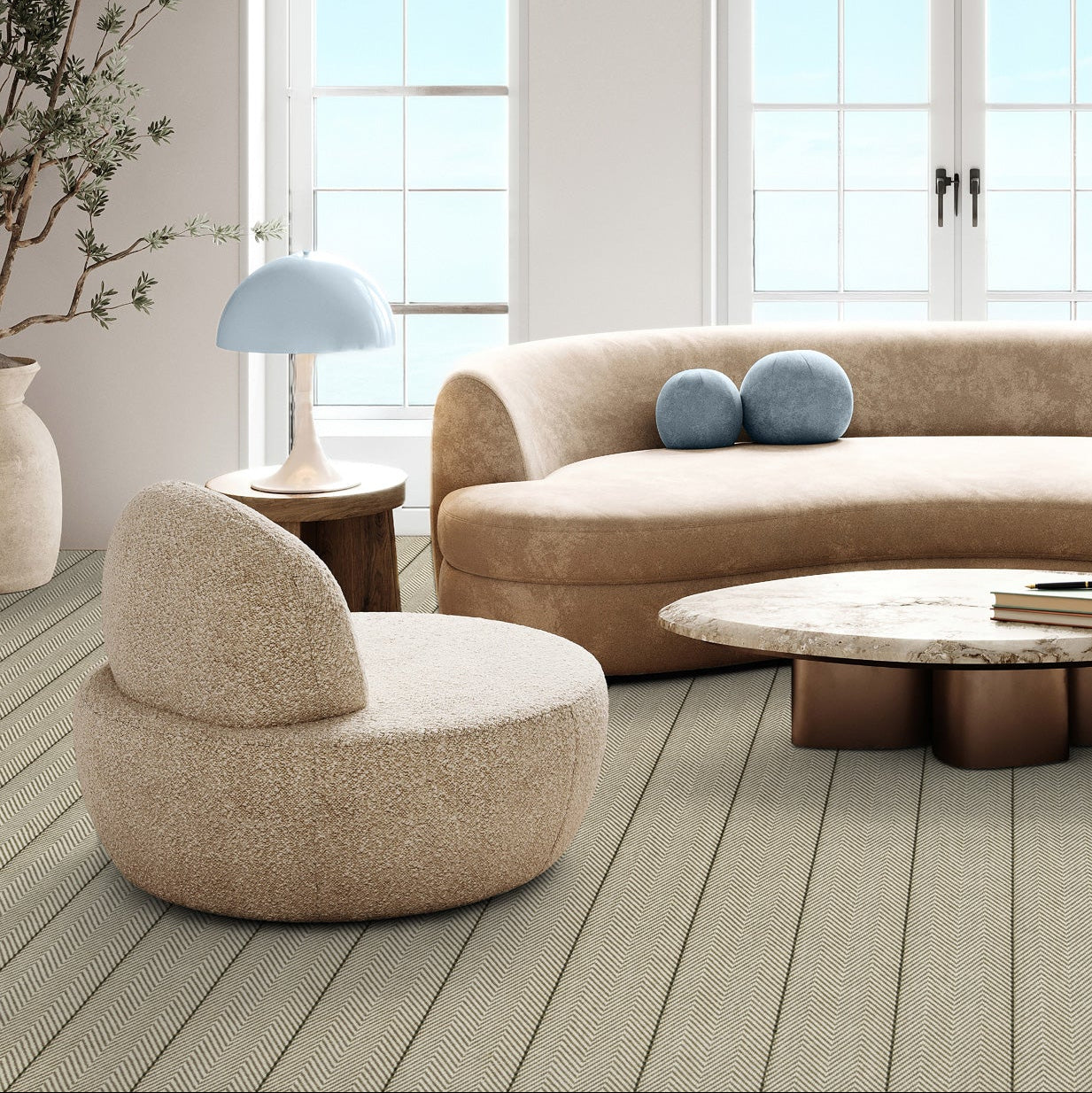 The Woven Edge Chevron wool flatweave carpet in Ash fitted in a refined neutral living room.
