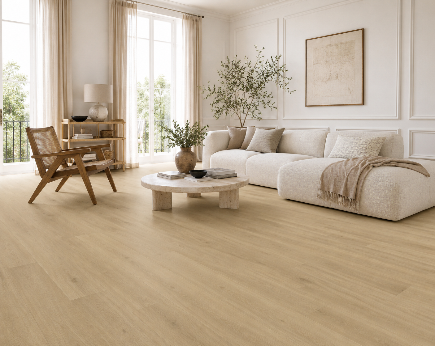 Light oak wood flooring in a bright, modern living room with a cream sectional sofa, wooden chair, and large windows.
