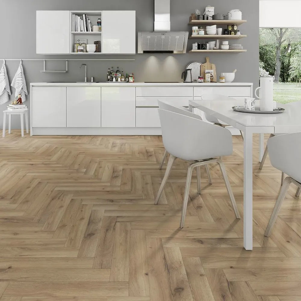Modern kitchen with white cabinets, wooden floor, and dining area.