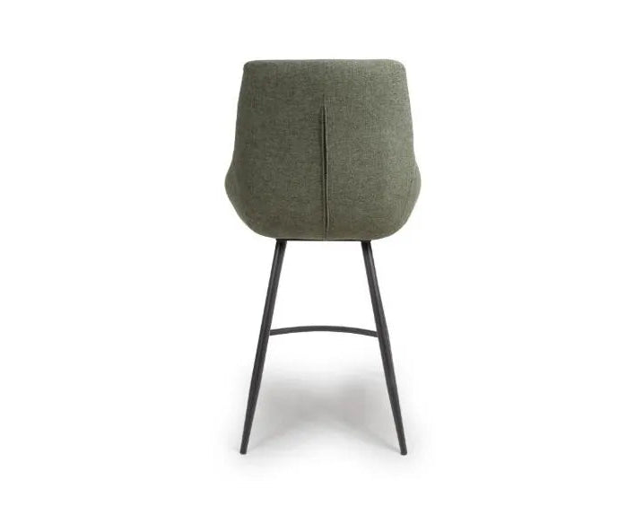 Green chair with black legs on a white background
