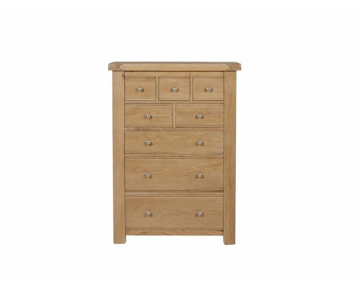 Wooden dresser with multiple drawers on a white background