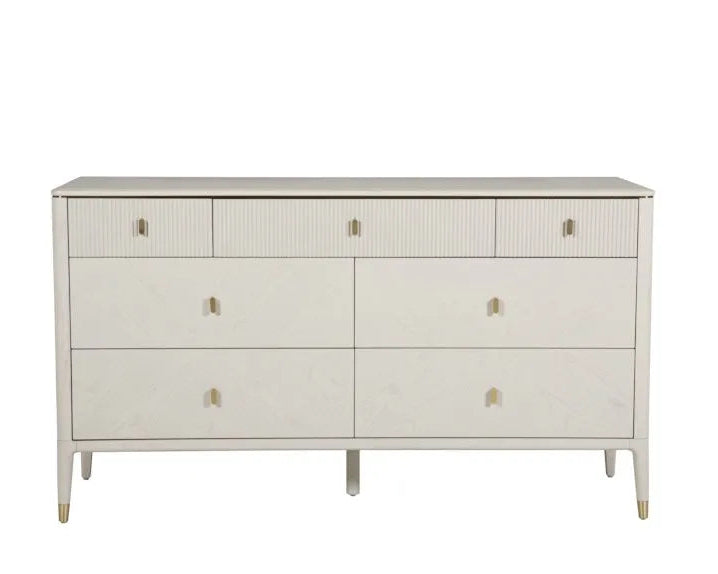 White dresser with gold accents on a white background