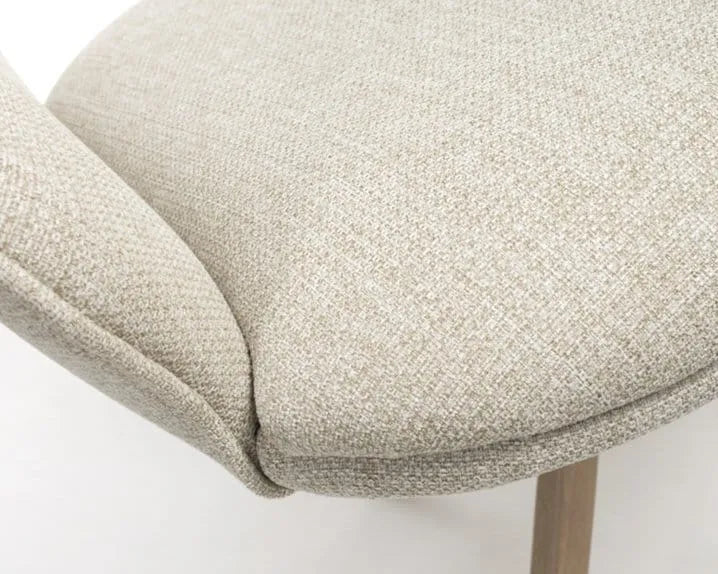 Close-up of natural fabric upholstered swivel dining chair seat