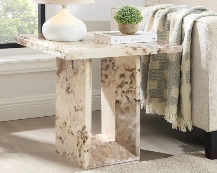 marble lamp table styled beside sofa with neutral decor in modern living room