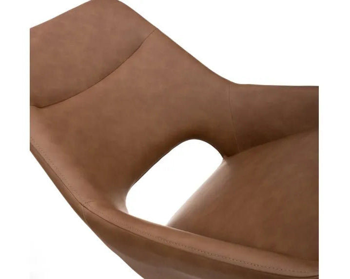 Close-up of tan PU upholstered swivel dining chair seat
