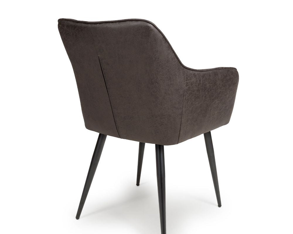 Grey upholstered chair with black legs on a white background