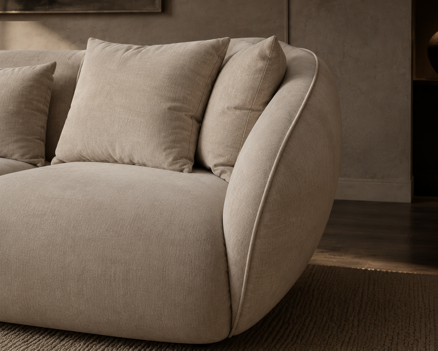 Close-up of the Cove sofa’s rounded upholstered arm and piped edge