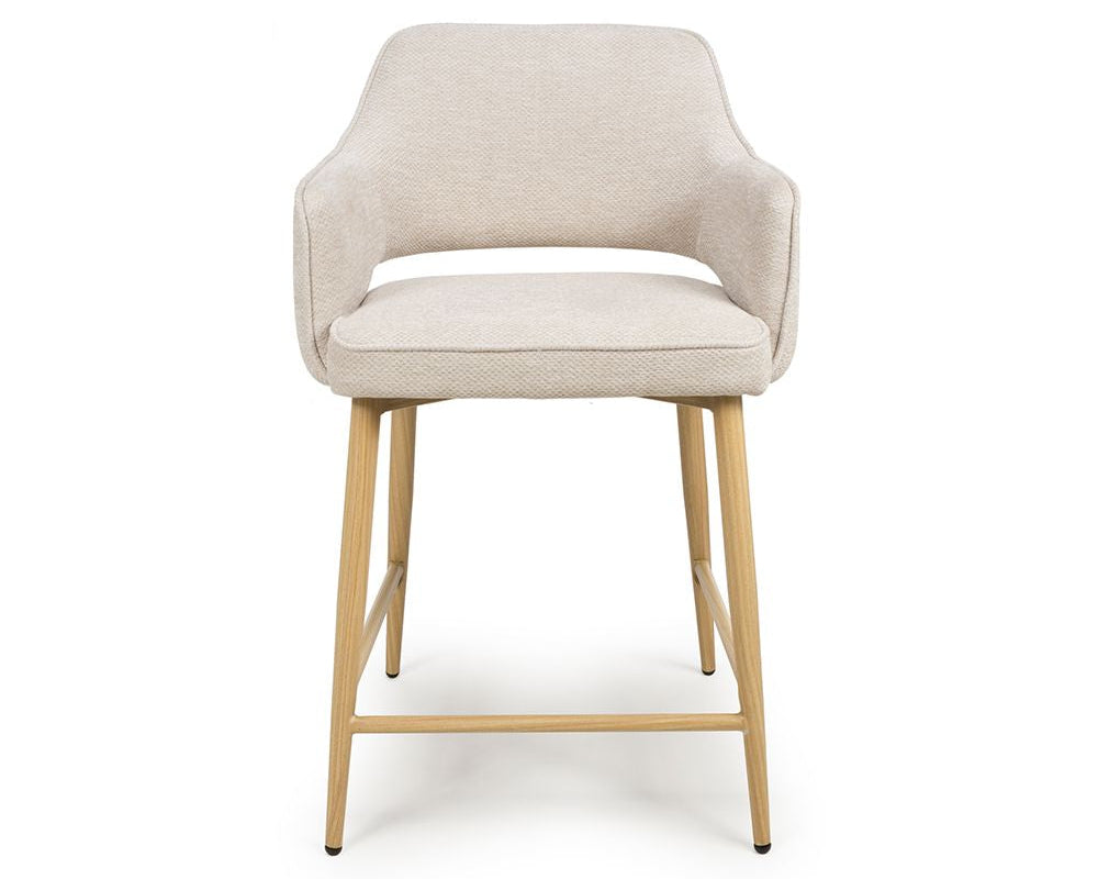 Beige chair with wooden legs on a white background