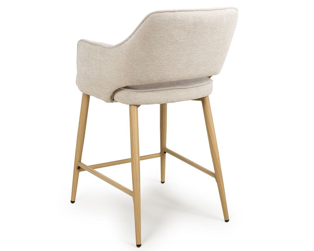 Beige bar stool with wooden legs on a white background
