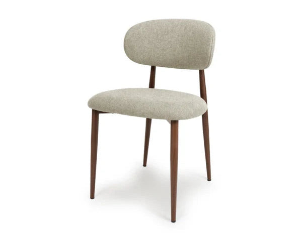 Front view of the Etta beige fabric dining chair with a curved upholstered backrest