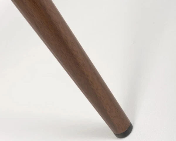 Close-up of the wooden style leg on the Etta dining chair