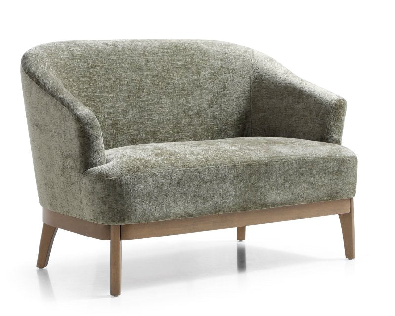Green upholstered sofa with wooden legs on a white background