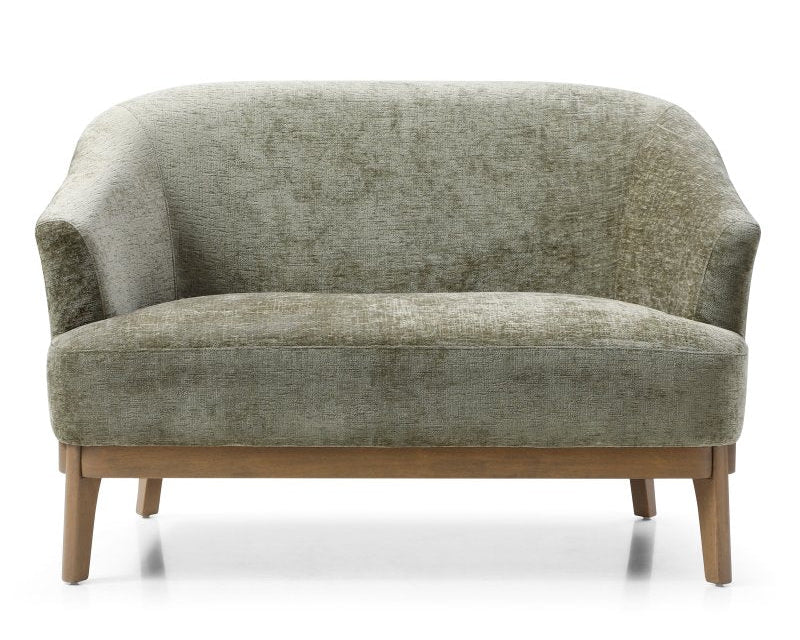 Green upholstered sofa with wooden legs on a white background