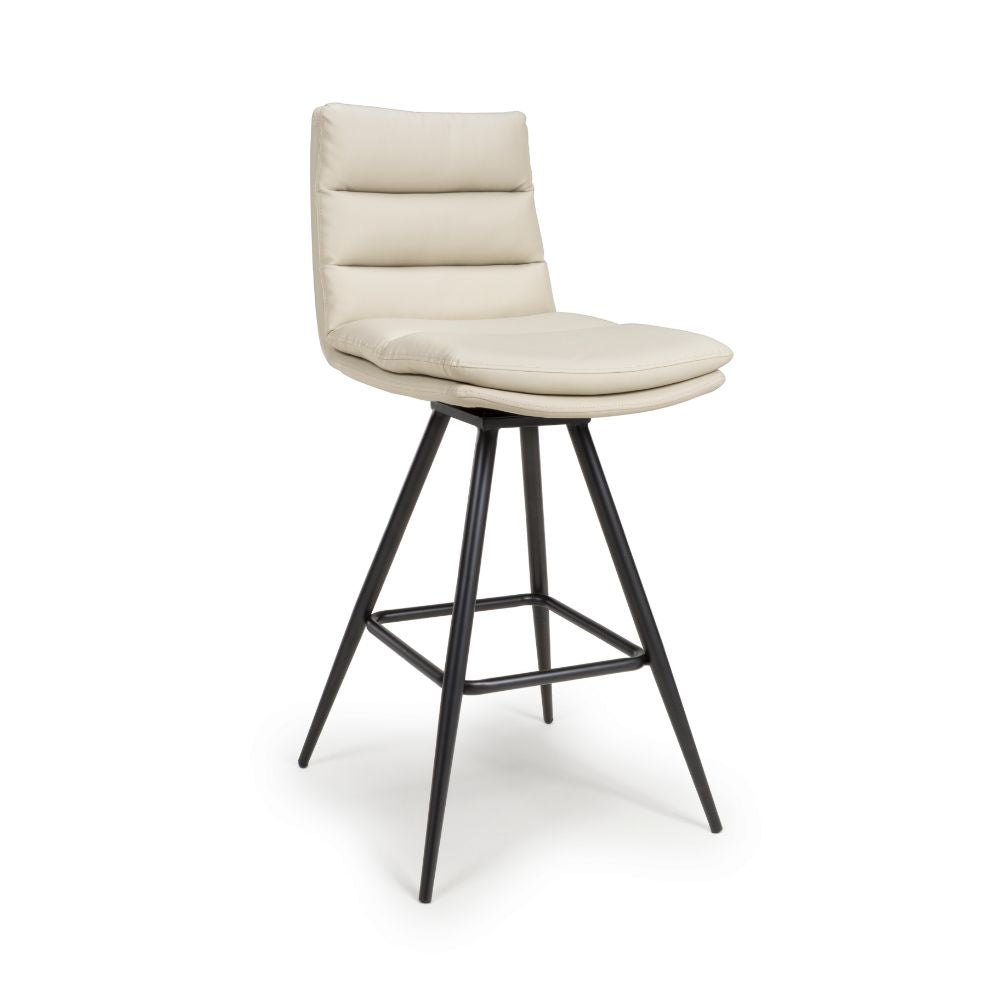 Beige bar stool with black metal legs on a white background