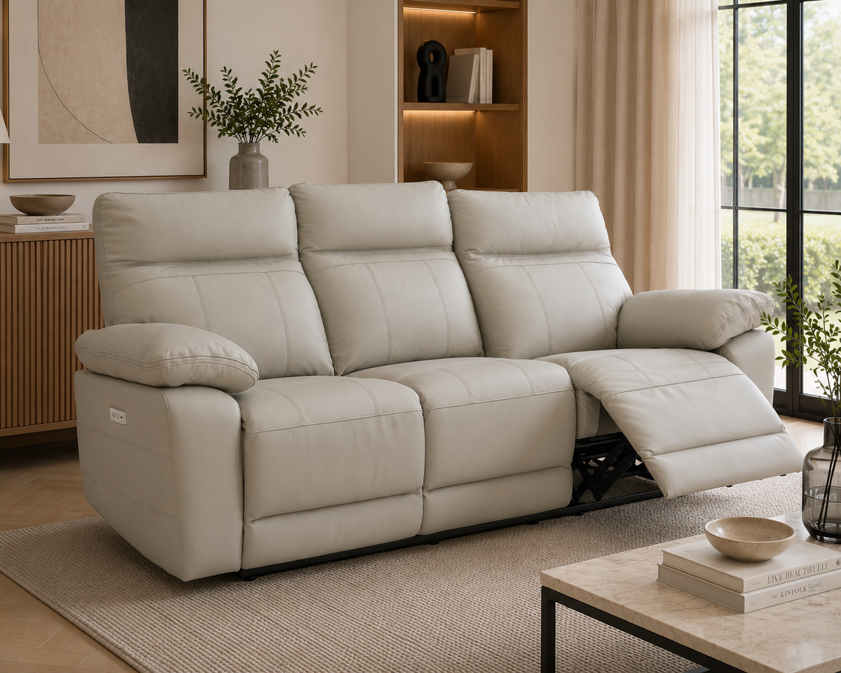 Positano 3 Seater Electric Reclining Leather Sofa in light grey with one seat fully reclined in a bright contemporary living room.