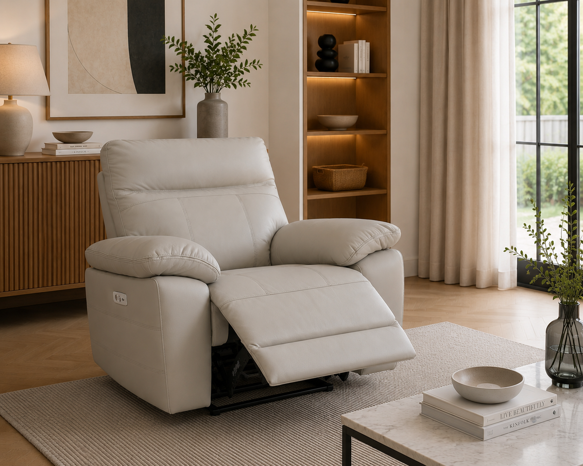 Positano light grey leather electric recliner armchair shown fully reclined in a modern living room.