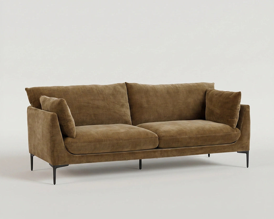 Angled view of the Venn sofa showing its elevated frame and relaxed cushions