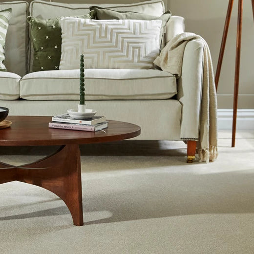 Zenith Carpet in Highcliffe fitted in an elegant neutral living room with cream sofa and wooden coffee table.